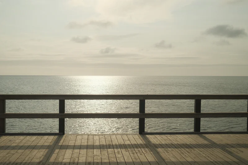 a photograph of a bench with a bench and a bench in the background