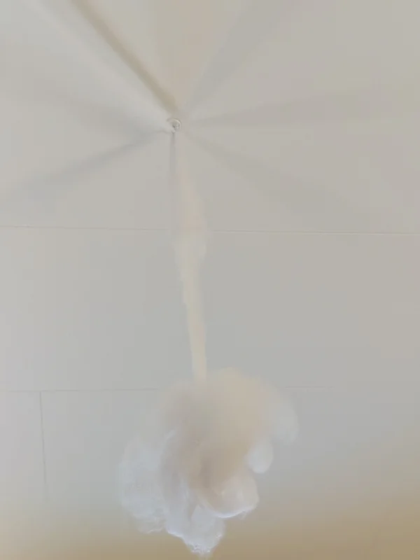 a photograph of a white umbrella with a white umbrella and a white umbrella